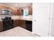 Modern kitchen features stainless steel appliances, dark cabinets, and light countertops at 8161 Cr 647, Bushnell, FL 33513