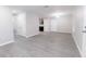 Spacious living room boasts modern gray vinyl flooring and ample natural light at 8161 Cr 647, Bushnell, FL 33513