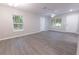Bright and airy living room featuring gray vinyl flooring and natural light at 8161 Cr 647, Bushnell, FL 33513