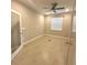 Neutral bedroom with tiled floor, ceiling fan, and a window letting in plenty of natural light at 8949 Sw 76Th St, Ocala, FL 34481