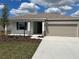 Charming single-story home with a well-manicured front yard and a two-car garage at 8949 Sw 76Th St, Ocala, FL 34481