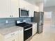 Well-equipped kitchen with granite countertops, stainless steel appliances, and subway tile backsplash at 8949 Sw 76Th St, Ocala, FL 34481