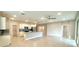 Open-concept living room and kitchen area with stainless steel appliances at 8949 Sw 76Th St, Ocala, FL 34481