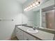 Bathroom featuring double sinks and a large mirror at 911 Beverly Harbors Dr # 16, Leesburg, FL 34748