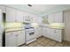 This beautiful kitchen features a full suite of appliances, plenty of cabinets and under cabinet lights at 911 Beverly Harbors Dr # 16, Leesburg, FL 34748