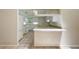 Bright kitchen with white cabinets, neutral countertops and view to eat-in bar area and the living room at 911 Beverly Harbors Dr # 16, Leesburg, FL 34748