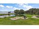 Aerial view of a playground by a lake with lush landscaping at 911 Beverly Harbors Dr # 16, Leesburg, FL 34748