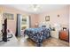 Bright bedroom features tile floors, ceiling fan, and large window at 10431 Reagans Run Dr, Clermont, FL 34711