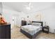 A cozy bedroom features a well-made bed, neutral colors, and natural light at 10431 Reagans Run Dr, Clermont, FL 34711