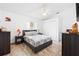 A bedroom features neutral tones, a comfortable bed, and a ceiling fan at 10431 Reagans Run Dr, Clermont, FL 34711