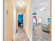 Open hallway with an arched doorway leading into a living area with stylish tile flooring at 10431 Reagans Run Dr, Clermont, FL 34711