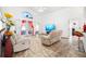 Spacious living room filled with natural light, comfortable seating, and open layout, ideal for relaxation at 10431 Reagans Run Dr, Clermont, FL 34711