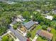 This aerial shot shows the property with lush landscaping and a convenient detached carport at 1109 Edmonds St, Leesburg, FL 34748