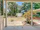 A backyard view from the porch featuring a storage shed and some lovely landscaping at 1109 Edmonds St, Leesburg, FL 34748