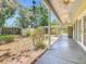 A spacious covered patio overlooks the landscaped backyard with a storage shed at 1109 Edmonds St, Leesburg, FL 34748