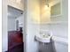 Cozy bathroom boasts a pedestal sink and vintage-inspired decor at 1109 Edmonds St, Leesburg, FL 34748
