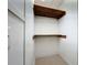 Walk-in closet with built-in shelving, offering practical storage solutions at 1109 Edmonds St, Leesburg, FL 34748