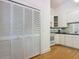 Bright kitchen with white cabinets, appliances and a large pantry at 1109 Edmonds St, Leesburg, FL 34748