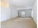 Spacious living area with vaulted ceilings and large windows for ample light at 1109 Edmonds St, Leesburg, FL 34748