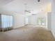Expansive living room has high ceilings and natural light from doors and windows at 1109 Edmonds St, Leesburg, FL 34748