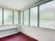 Cozy sun room with vintage jalousie windows and painted brick accents at 1109 Edmonds St, Leesburg, FL 34748