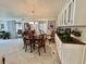 Dining area featuring a wood table, built-in cabinetry, and large windows providing natural light at 117 Jacaranda Dr, Leesburg, FL 34748