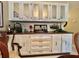 Dining room area with built in dry bar, glass storage, and decorative lighting at 117 Jacaranda Dr, Leesburg, FL 34748