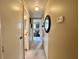 Hallway with carpet and neutral colored walls at 117 Jacaranda Dr, Leesburg, FL 34748