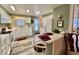A complete kitchen with the oven, dishwasher, and eat in bar to the dining area at 117 Jacaranda Dr, Leesburg, FL 34748