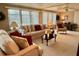 Inviting living room with comfortable seating, neutral tones, ceiling fan, and bright natural light at 117 Jacaranda Dr, Leesburg, FL 34748