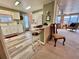 Open concept living space showcasing kitchen, dining area and living room with bar stool seating at 117 Jacaranda Dr, Leesburg, FL 34748
