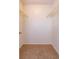 Walk-in closet featuring neutral carpet and metal racks for optimal storage at 12 Windtree Ln # 202, Winter Garden, FL 34787