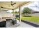 The covered patio is the perfect place to relax and enjoy the view of the backyard at 12120 Sumter Dr, Orlando, FL 32824