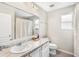 This bathroom features a sink, vanity, mirror, toilet, and shower at 12120 Sumter Dr, Orlando, FL 32824