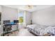 Bright bedroom featuring a desk, bed, and ceiling fan at 12120 Sumter Dr, Orlando, FL 32824