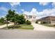 Charming two-story home with a well-manicured lawn and a spacious driveway at 12120 Sumter Dr, Orlando, FL 32824