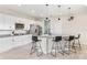 Charming kitchen featuring white cabinets, granite countertops, and stainless steel appliances at 12120 Sumter Dr, Orlando, FL 32824