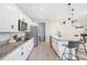 Well-lit kitchen with stainless steel appliances and convenient island seating at 12120 Sumter Dr, Orlando, FL 32824