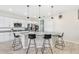 Modern kitchen with granite countertops, stainless steel appliances, and a large island at 12120 Sumter Dr, Orlando, FL 32824