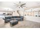Open-concept living space with tiled floors and comfortable gray sectional seating at 12120 Sumter Dr, Orlando, FL 32824
