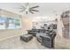 Spacious living room with a large window, leading into the bright kitchen and staircase at 12120 Sumter Dr, Orlando, FL 32824