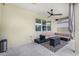 The covered patio features comfortable seating, a ceiling fan, and a view of the backyard at 12120 Sumter Dr, Orlando, FL 32824
