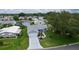 An aerial view of home in a neighborhood setting showcasing the well-kept yard at 1225 Zapata Pl, The Villages, FL 32159
