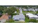 An overhead shot showing the home with back patio, lawn and neighborhood setting at 1225 Zapata Pl, The Villages, FL 32159