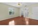 Sunny bedroom featuring a ceiling fan, window, and walk-in closet at 1225 Zapata Pl, The Villages, FL 32159