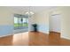 Open dining area adjacent to the living room, featuring an elegant chandelier at 1225 Zapata Pl, The Villages, FL 32159