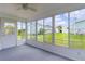 Enclosed lanai with wall to wall windows offering abundant natural light at 1225 Zapata Pl, The Villages, FL 32159