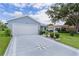 Exterior image of home, highlighting concrete driveway with decorative star at 1225 Zapata Pl, The Villages, FL 32159
