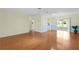Spacious living room offers hardwood floors, ample lighting, and room to relax at 1225 Zapata Pl, The Villages, FL 32159