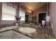 Well lit bathroom with a white sink, framed mirror, and tasteful decor at 1412 Forest Acres Dr, The Villages, FL 32162